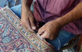 This image shows a rug that is being repaired.
